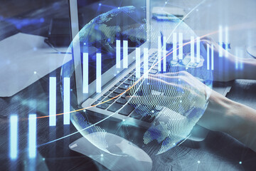 Double exposure of woman hands typing on computer and forex chart hologram drawing. Stock market invest concept.