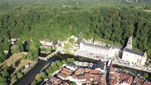 Flight over the city Brantome en Perigord on summer day. France