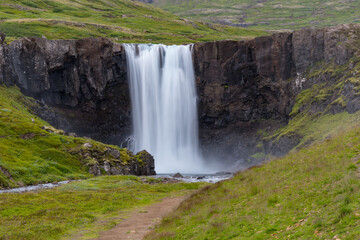 Waterfall gufufoss in river Fjardara in Seydisfjordur in east Iceland