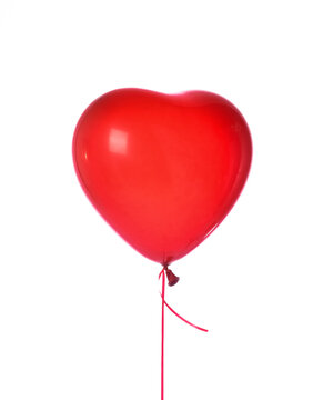 Single red heart latex balloon object for birthday party or valentines day isolated on a white 