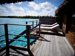 Lounge Chairs by Ocean on Sunny Day Bora Bora