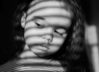 Black and white photo on the girl fall horizontal shadows