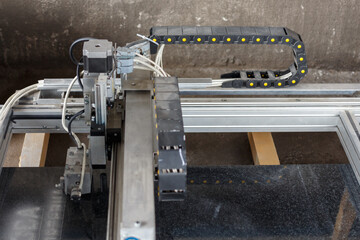 Automatic engraving machine produces black granite processing.