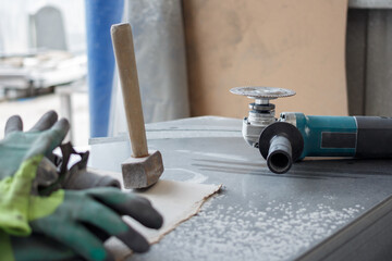Working tools on dusty granite stone.