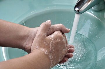 Fototapeta premium Washing Hands During the Covid-19 Pandemic