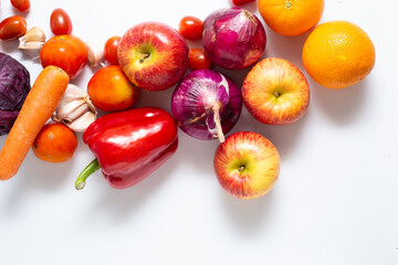 Top view various colorful vegetables and fruits isolated on white background, creative flat layout.