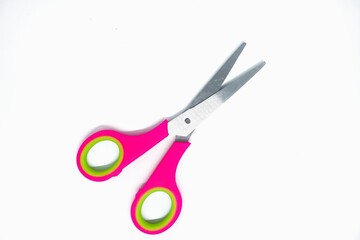 Pink scissors isolated on white background. Cutting tools from stainless steel. 