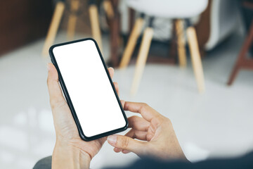 cell phone mockup blank white screen.woman hand holding texting using mobile on desk at coffee shop.background empty space for advertise.work people contact marketing business,technology
