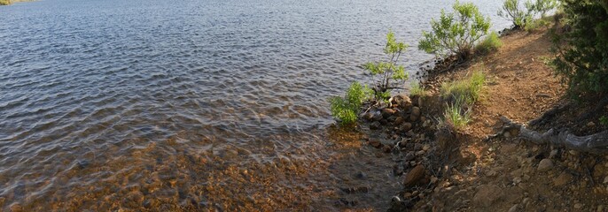 Panoramic close up of waters rippling toward the shore of Lake Elmer Thomas in Comanche County, Oklahoma.