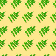 Obraz premium Seamless pattern. Green leaves isolated on a yellow background