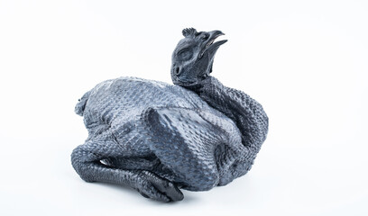 A fresh black chicken on white background