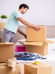 Young man moving to new apartment