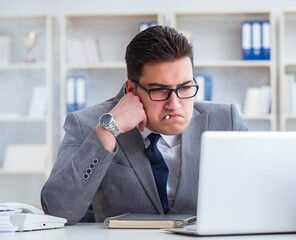Naklejka premium Businessman smoking in office at work