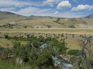 Fototapeta na wymiar Wyoming landscape with the Yellowstone River flowing toward Gardiner, Montana.
