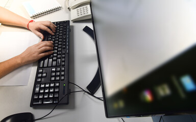 person typing on a keyboard