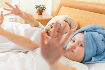 two cute little girls with towel on their heads