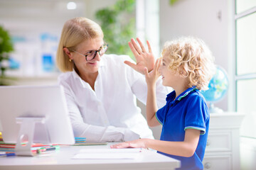 Obraz premium Online remote learning. School kids with computer.