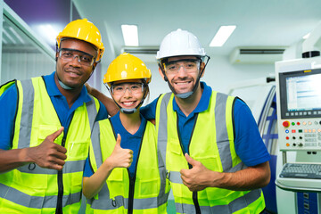 Close up portrait team of young multiethnic group male and female technician staff wearing a protective helmet. Happy teamwork laugh smile posing at camera smiling.
