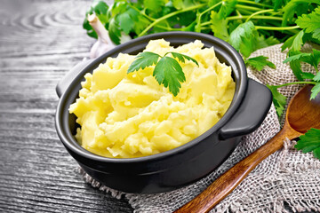 Potatoes mashed in saucepan on black board