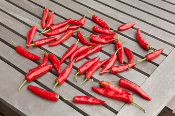 Red peppers on the wooden deck