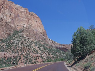 Scenic drive around with views of steep red wall cliffs at Zion National Park, Utah, USA.