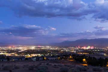 Wide angle view of the city of Reno during a wind and dust storm causing low visibility and glowing halos around each light