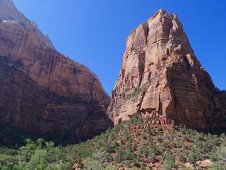 Steep high red cliffs and unique landscape of Zion National Park, Utah.