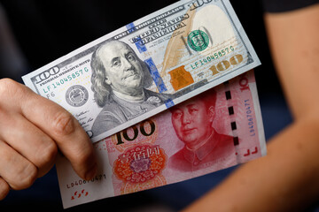 U.S. dollars and Chinese yuan in hand