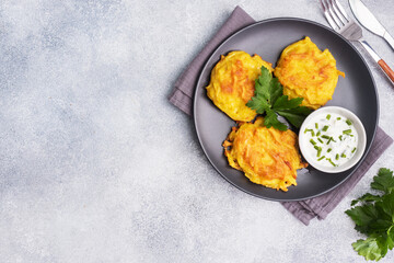 Fried cakes of grated potatoes on the plate with sauce. Traditional pancakes boxty raggmunk.