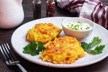 Fried cakes of grated potatoes on the plate with sauce. Traditional pancakes boxty raggmunk.
