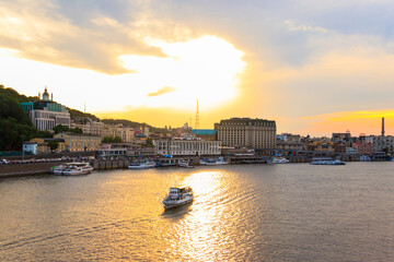 Naklejka premium View of the Dnieper river with sailing ships at sunset in Kiev, Ukraine