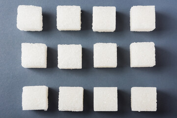 White sugar cube sweet food ingredient geometry pattern, studio shot isolated on a gray background,...