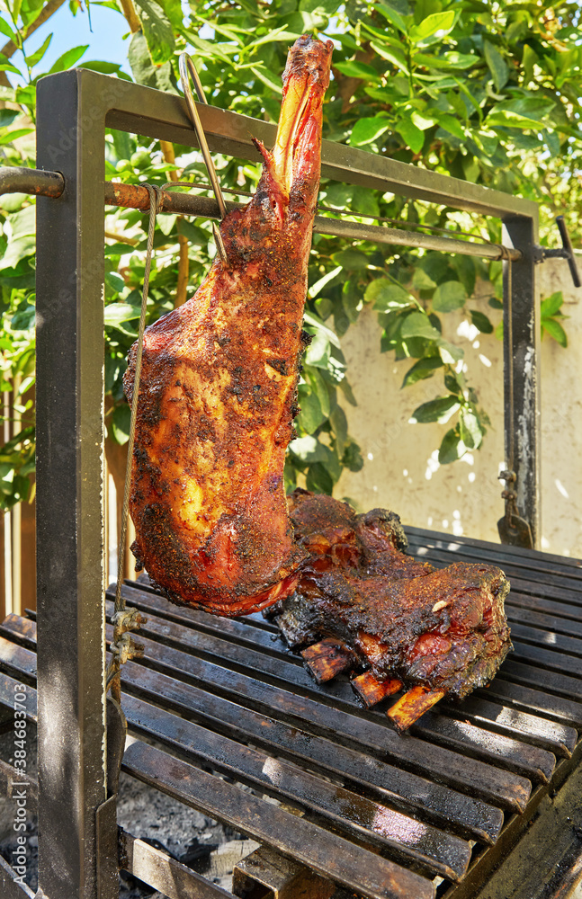 Wall mural Slow smoked lamb meat tenderloin over barbecue