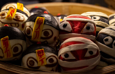 Dumplings steaming hot in a wicker basket.