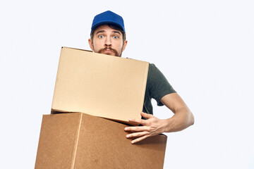 Working man with boxes in hands delivery service work lifestyle