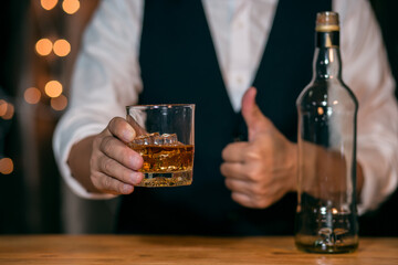 Whisky is poured into glass Beautiful bokeh