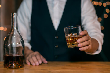 Whisky is poured into glass Beautiful bokeh