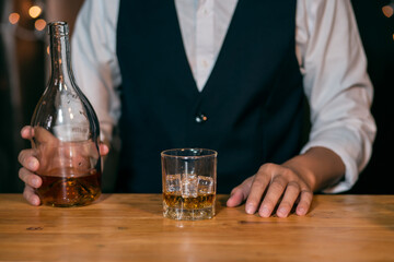 Barman pouring whiskey whiskey glass beautiful night