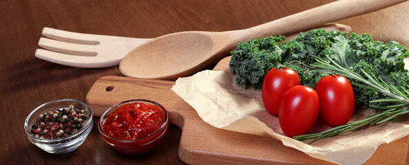 Cherry tomatoes on a wooden board. European cuisine.