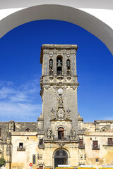 Bell tower of Santa Maria de la Asuncion church in Arcos de la Frontera, Spain