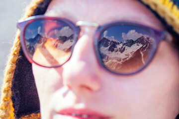 happy free woman in summer Elbrus. reflection of the mountain in glasses