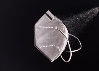 Protection against spreading the viruses during COVID-19 pandemic - concept photo with a FFP2 KN95...
