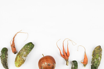  rotten apple, cucumber, carrot on white background