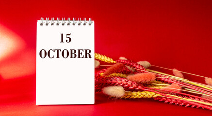 Calendar with date on red background, 15 October