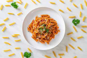 spirali or spiral pasta with tomato sauce