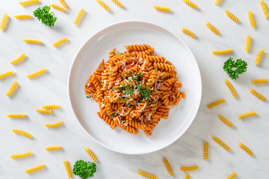 spirali or spiral pasta with tomato sauce