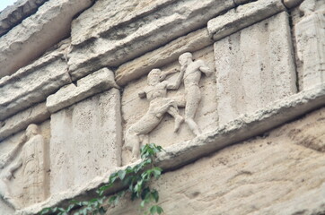 Photo of greek sculpture on the wall