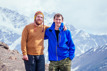 Obraz na płótnie Canvas two happy friends in the mountains of Elbrus