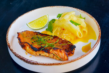 Delicious beef steakes on a white plate. Juicy piece of barbecue meat served in a restaurant.