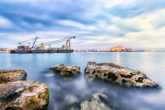 Long exposure landscape of port of Mersin. The Port of Mersin (Turkish: Mersin Limani), is a major seaport located on the north-eastern coast of Mediterranean Sea in Mersin, southern Turkey.